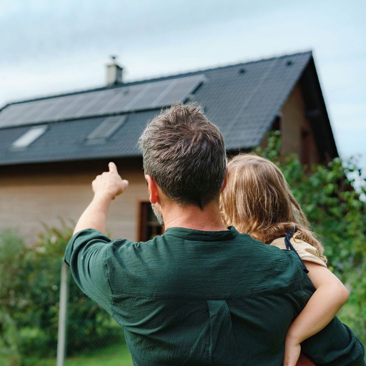 Pointing To Residential Home With Solar Panels